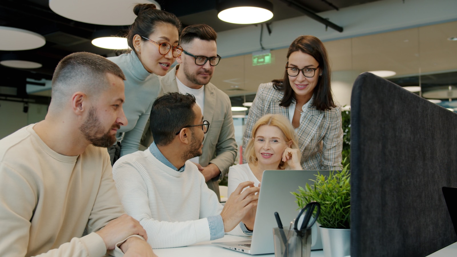 Professionals collaborating around an office table